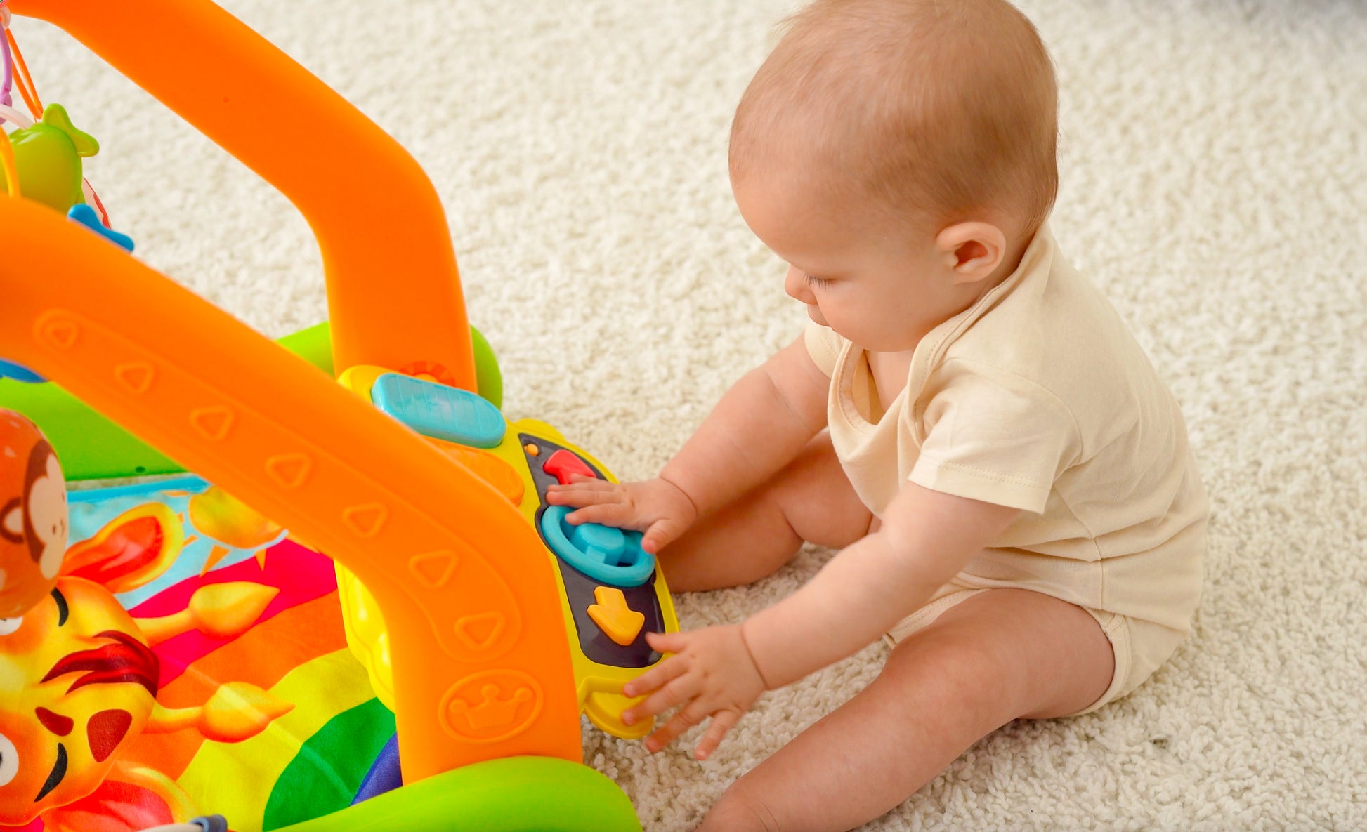 4-in-1 baby activity center for tummy time, sitting, learning to walk, and on-the-go fun. Features over 30 sounds & songs including ABC’s and Wheels on the Bus. Includes 4 rattles, a mirror, and a piano for interactive play and exploration. Lead-free materials ensure safety exceeds US and EU toy regulations. Packaged for gifting, easy assembly, and machine washable mat. Requires 2xAAA batteries (not included).