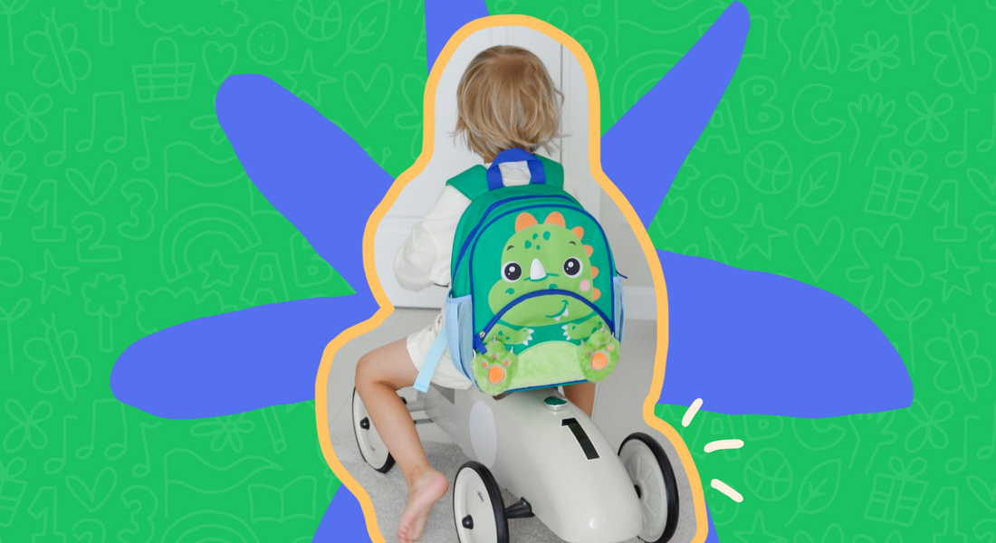 Kid with dino backpack on tricyclle