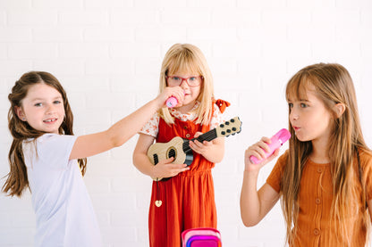 Kids Mini Karaoke Machine featuring 20+ pre-loaded kid songs like Twinkle Twinkle Little Star and Wheels on the Bus. Connects to phone or tablet via Bluetooth for playing songs from Spotify, YouTube, and Apple Music. Portable, durable design perfect for playdates and open mic nights. Includes 4 voice effects and echo mode for quality sound. Rechargeable battery provides up to 6 hours of playtime.