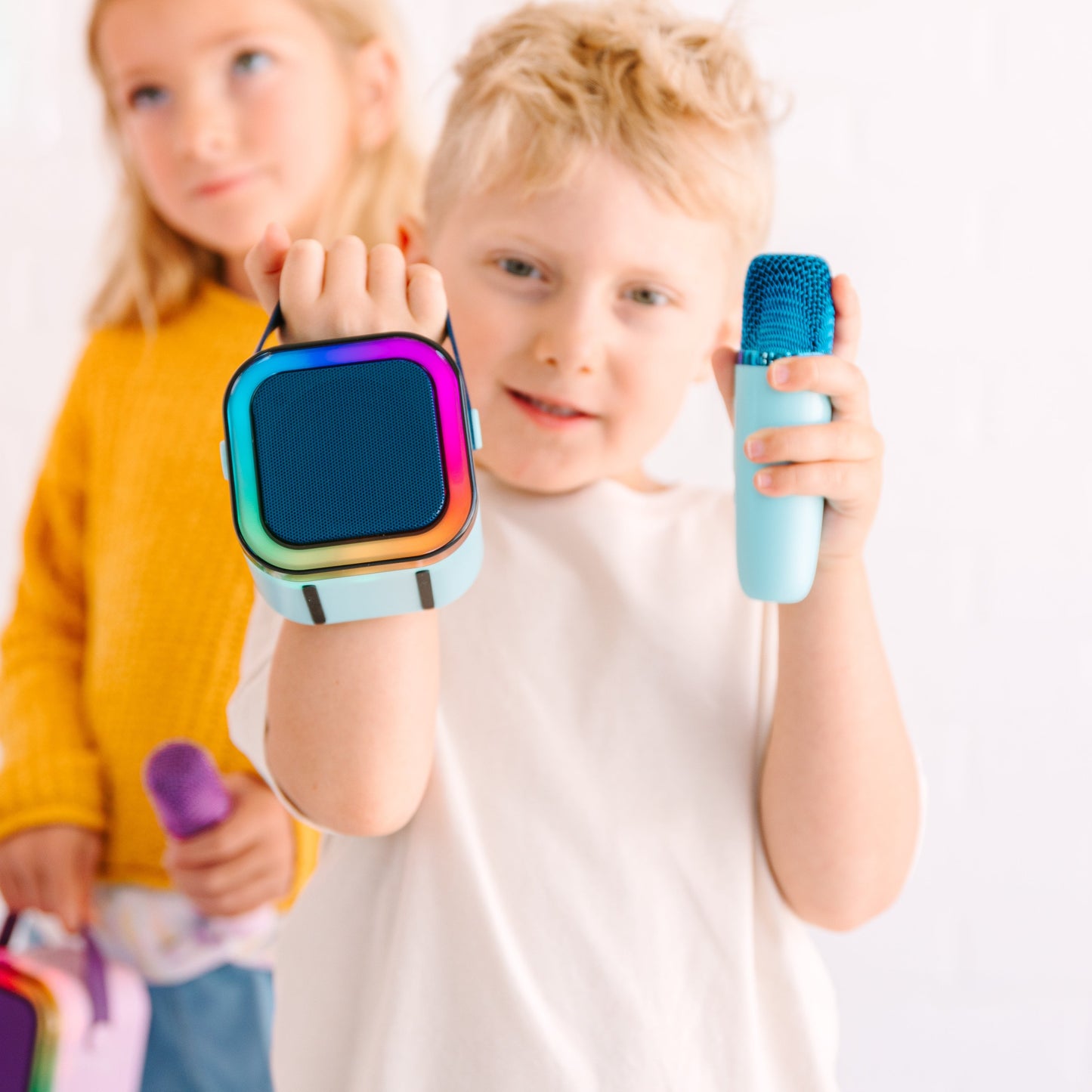 Kids Mini Karaoke Machine featuring 20+ pre-loaded kid songs like Twinkle Twinkle Little Star and Wheels on the Bus. Connects to phone or tablet via Bluetooth for playing songs from Spotify, YouTube, and Apple Music. Portable, durable design perfect for playdates and open mic nights. Includes 4 voice effects and echo mode for quality sound. Rechargeable battery provides up to 6 hours of playtime.