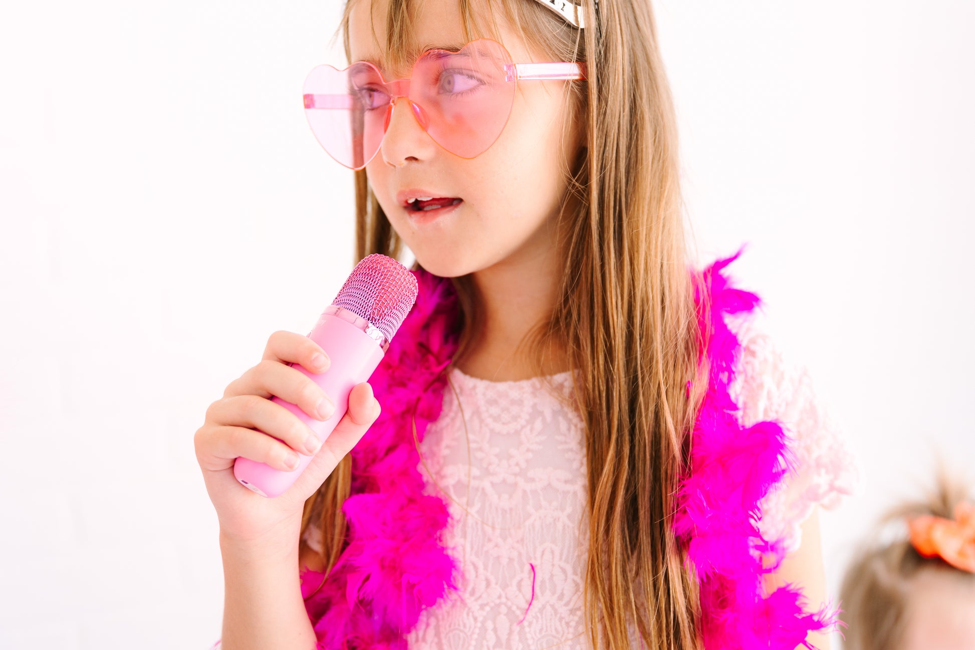 Kids Mini Karaoke Machine featuring 20+ pre-loaded kid songs like Twinkle Twinkle Little Star and Wheels on the Bus. Connects to phone or tablet via Bluetooth for playing songs from Spotify, YouTube, and Apple Music. Portable, durable design perfect for playdates and open mic nights. Includes 4 voice effects and echo mode for quality sound. Rechargeable battery provides up to 6 hours of playtime.