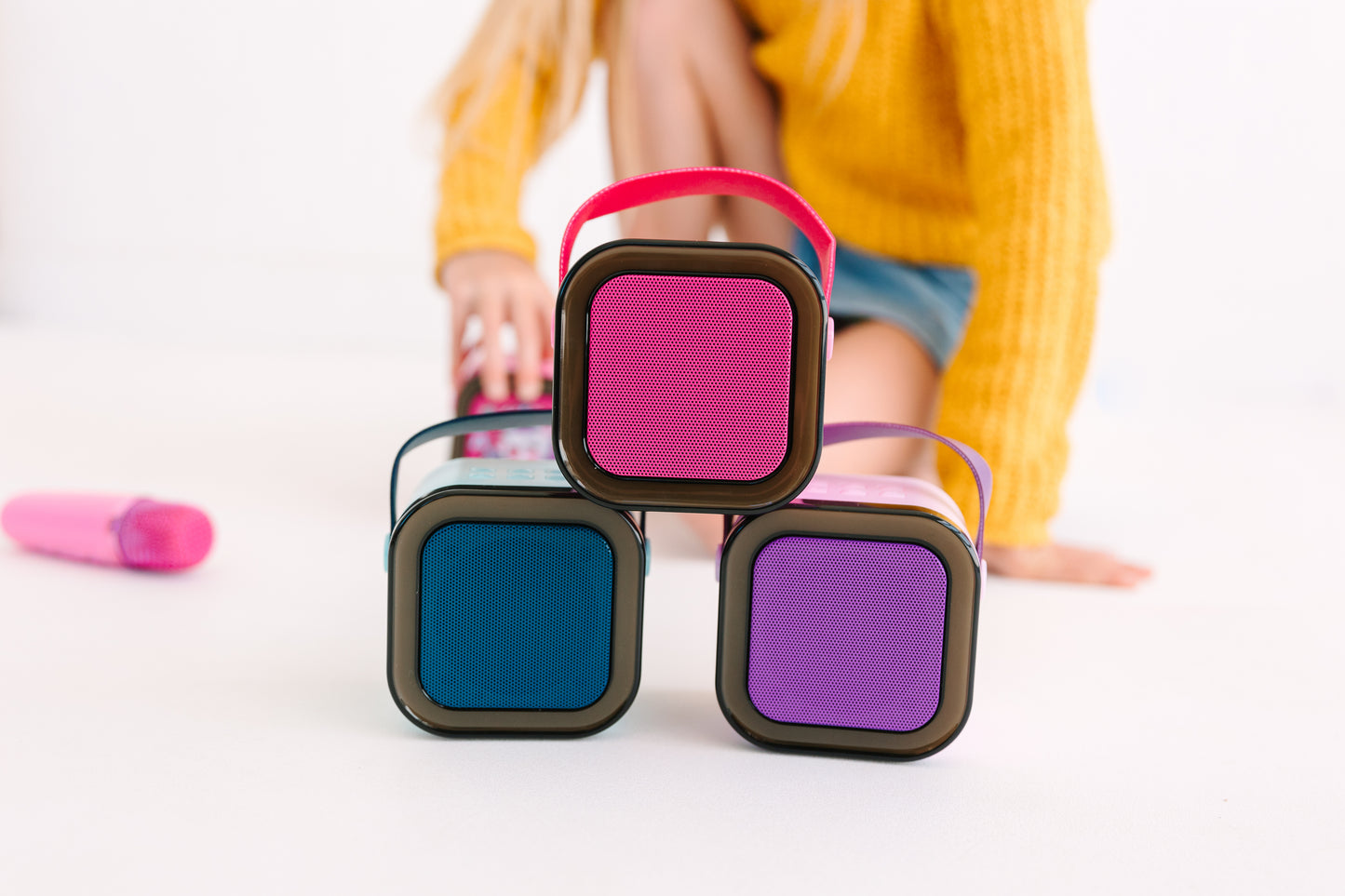 Kids Mini Karaoke Machine featuring 20+ pre-loaded kid songs like Twinkle Twinkle Little Star and Wheels on the Bus. Connects to phone or tablet via Bluetooth for playing songs from Spotify, YouTube, and Apple Music. Portable, durable design perfect for playdates and open mic nights. Includes 4 voice effects and echo mode for quality sound. Rechargeable battery provides up to 6 hours of playtime.