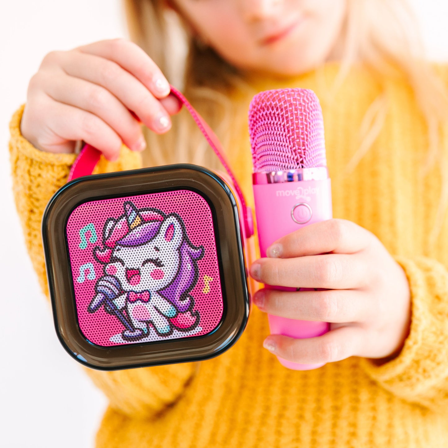 Kids Mini Karaoke Machine featuring 20+ pre-loaded kid songs like Twinkle Twinkle Little Star and Wheels on the Bus. Connects to phone or tablet via Bluetooth for playing songs from Spotify, YouTube, and Apple Music. Portable, durable design perfect for playdates and open mic nights. Includes 4 voice effects and echo mode for quality sound. Rechargeable battery provides up to 6 hours of playtime.