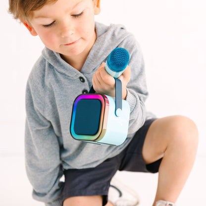 Kids Mini Karaoke Machine featuring 20+ pre-loaded kid songs like Twinkle Twinkle Little Star and Wheels on the Bus. Connects to phone or tablet via Bluetooth for playing songs from Spotify, YouTube, and Apple Music. Portable, durable design perfect for playdates and open mic nights. Includes 4 voice effects and echo mode for quality sound. Rechargeable battery provides up to 6 hours of playtime.